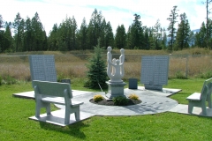 Memorial Garden in Invermere, BC, provided and installed by Kootenay Monument, features memorial benches, statuary and memorial books.